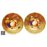 Two Coalport cabinet plates decorated by Richard Budd with hand painted apples and red grapes,