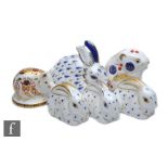 Six assorted Royal Crown Derby paperweights comprising three seated rabbits with gold stoppers, a