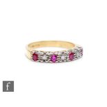 An 18ct hallmarked ruby and diamond ring, alternating stones to a plain shank, weight 3g, ring