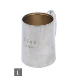 A hallmarked silver half pint tankard of plain form with engraved initials to front, weight 7.5oz,
