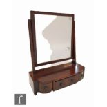A 19th Century mahogany breakfront dressing table mirror fitted with three drawers below a