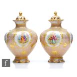 A pair of late 19th to early 20th Century Dresden porcelain vase and covers each decorated with hand