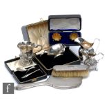 A parcel lot of assorted hallmarked silver items to include two cream jugs, a cased quaiche, a