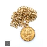 An Elizabeth II full sovereign pendant loose to a 9ct mount and suspended from a 9ct belcher link