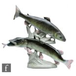 Two Royal Dux models of a fish, the first a relative of the salmon, the second a pike with a smaller