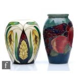 Two small Moorcroft Pottery vases, the first decorated in the Finches pattern, the second of ovoid