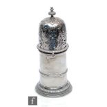 A hallmarked silver cylindrical sugar castor with gadroon detail to spread foot, weight 10oz, height