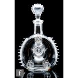A Remy Martin brandy bottle made by Baccarat, of compressed ovoid form with applied decorative
