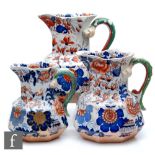 A set of three 19th Century graduated Masons Ironstone Hydra jugs, each with blue and burnt red