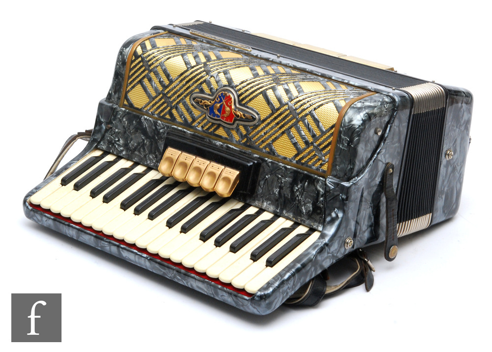 A Baracole seventy nine key accordion in grey marbled effect case and outer simulated crocodile skin