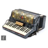 A Baracole seventy nine key accordion in grey marbled effect case and outer simulated crocodile skin