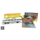 Three assorted diecast models, Dinky 954 Vega Major Luxury Coach on carded base in bubble,