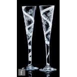 A pair of 20th Century Royal Brierley oversized glass champagne flutes, with a long funnel bowl,