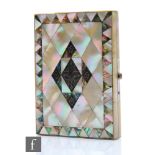 A 19th Century silver inlaid, mother of pearl and abalone shell decorated card case, opening to