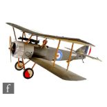 A petrol driven Sopwith bi-plane model No 5180 with occupant, with fabric and wooden frame,