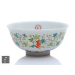 A Chinese famille rose bowl, Yongzheng six-character mark, the white glazed bowl decorated with