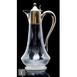 A late 19th to early 20th Century clear crystal jug, of low shouldered form with tapering neck, with