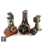 Three small Stuart vertical green painted steam engines, each with oscillating pistons, one