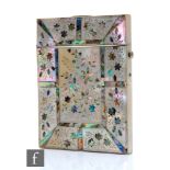 A 19th Century mother of pearl card case inlaid with sections of sprays of flowers, width 8cm.