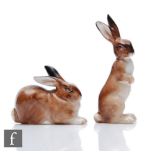 Two Royal Doulton K series model rabbits comprising K37 a seated rabbit with ears back, length 4.