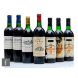 A collection of seven bottles of French red wines, to include three bottles OF 1986 Chateau Rocher