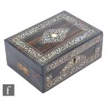 An early 19th Century coromandle mother of pearl inlaid work box, the lid opening to reveal a fitted