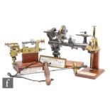 An early 20th Century Lorch watchmaker's lathe, a brass watch case machine, a brass Uplighting