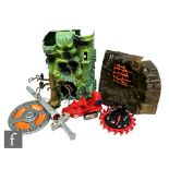 A collection of Mattel Masters of the Universe toys, to include Castle Grayskull, Snake Mountain,