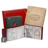 A large red vinyl album containing Edwardian postcards, glamour, a similar smaller album of flowers,