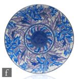 A 1930s Art Deco Charlotte Rhead for Crown Ducal charger decorated in the Blue Peony pattern,