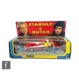 A Corgi 292 Starsky & Hutch Ford Torino diecast model in red with white stripe, chrome front and