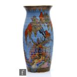 A large 1930s Art Deco Crown Devon Fieldings  vase decorated with a stylised tree lined landscape