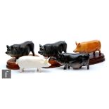 Four Royal Doulton model pigs, together with a Beswick Ch. Wall Queen 40, latter restored. (5)