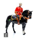 A Beswick Canadian Mountie, model 1375, printed crest mark, retains original foil label.