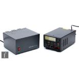 An Astron RS-20A power supply and a QJE QJ-PS50II power supply. (2)