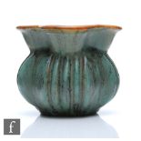 A 1930s Michael Andersen and Sons shape 421 gourd vase glazed in a matt green and brown, retains