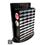 A Pyramid International point of sale button badge display unit, with stock of various badges