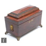 A 19th Century rosewood crossbanded mahogany tea caddy or sarcophagal form, gilt lion mask mounts on