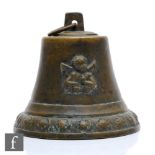 A late 19th to early 20th Century Medieval style cast brass bell with winged cherub mounts, iron