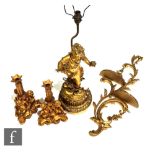 A 20th Century French composite gilt bedside lamp modelled as a young girl holding a bunch of