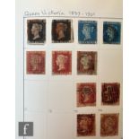 A postage stamp collection contained in a large binder album, mainly used Great Britain Queen