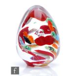 A later 20th Century studio glass paperweight by Catherine Arrowsmith, the ovoid form internally