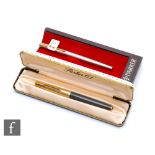 A Parker 61 fountain pen, grey case, with a later Parker Falcon pen, both cased. (2)