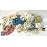 A collection of assorted doll clothes, hats and assorted fabrics. (qty)