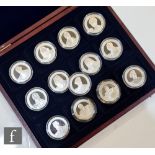 An Elizabeth II Great Britons thirteen silver proof five pound coins, with eleven certificates and