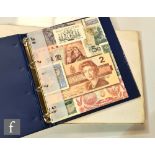 An extensive collection of world banknotes contained in four albums, Europe, Asia, South America,