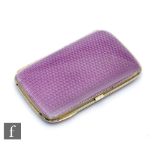 A continental silver cushioned rectangular cigarette case with purple enamel decoration to front and