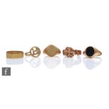 Four assorted early 20th Century and later 9ct hallmarked rings to include a stone set signet and