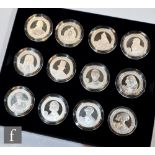 An Elizabeth II Great Britons set of twelve silver proof five pound coins for Guernsey, Jersey and