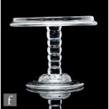 An 18th Century glass patch stand circa 1740, the circular top with a vertical rim, raised to a